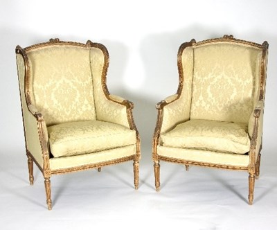 Lot 704 - A pair of Louis XVI style fauteuils with...