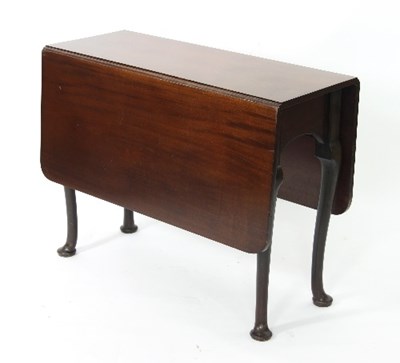 Lot 708 - A George II style mahogany drop-leaf table,...