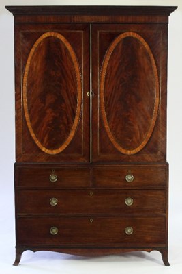 Lot 718 - An early 19th Century mahogany linen press...