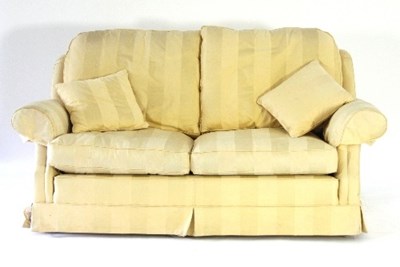 Lot 720 - A pale yellow upholstered two-seater settee,...