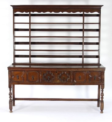 Lot 726 - An oak dresser with shelves over, the base...