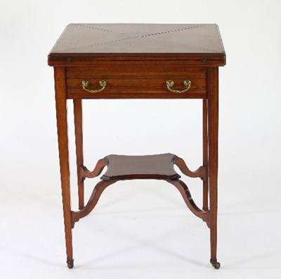 Lot 729 - An Edwardian walnut envelope card table, each...