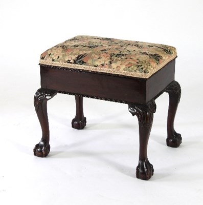 Lot 730 - A mahogany box top piano stool, on carved...