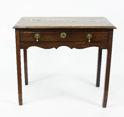 Lot 739 - An 18th Century elm table fitted a drawer, on...