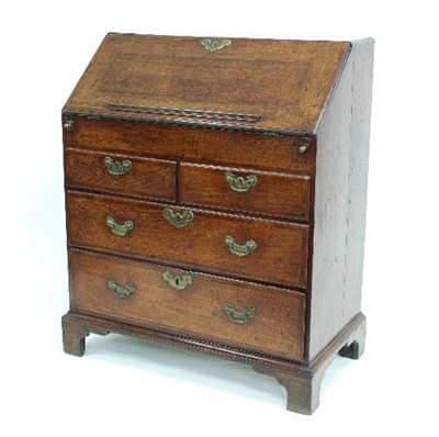 Lot 766 - A George II oak bureau fitted drawers, secret...