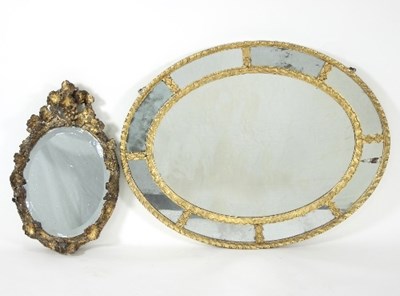 Lot 777 - An 19th Century oval wall mirror, the nine...