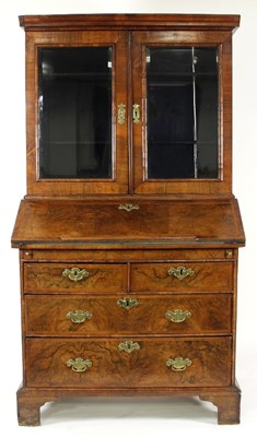 Lot 781 - A walnut bureau bookcase with moulded cornice,...