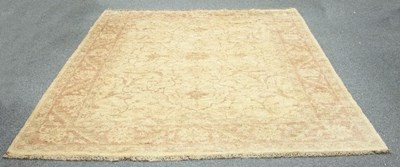 Lot 815 - A modern carpet, the foliate design to a camel...