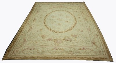 Lot 817 - An Aubusson style carpet, the central oval...