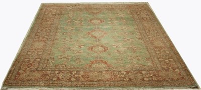 Lot 818 - An Eastern style carpet, with foliate designs...