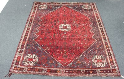 Lot 819 - A Shiraz carpet with large central medallion...