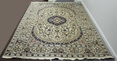 Lot 823 - A modern Persian style rug, the central...