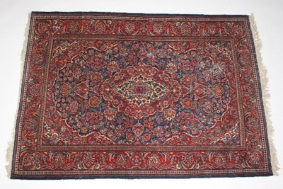 Lot 830 - A Kashan rug with central medallion within a...