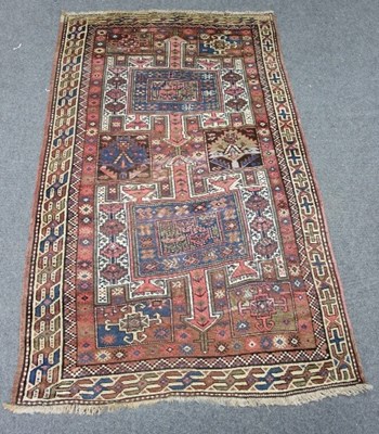 Lot 831 - A Kazak rug with double pole medallion on a...