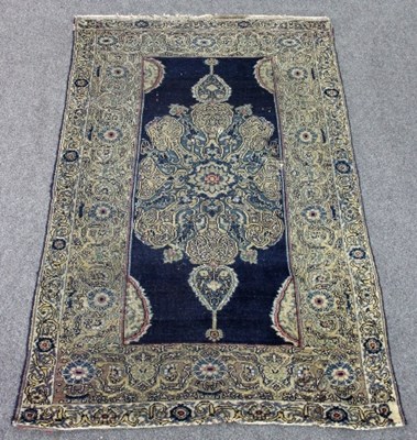 Lot 834 - A Kirman rug with elaborate central medallion...