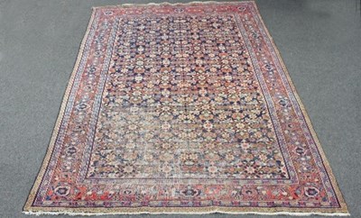 Lot 835 - A Tabriz carpet with blue ground floral and...