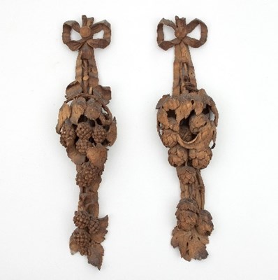 Lot 847 - A pair of carved limewood wall mounts, one...