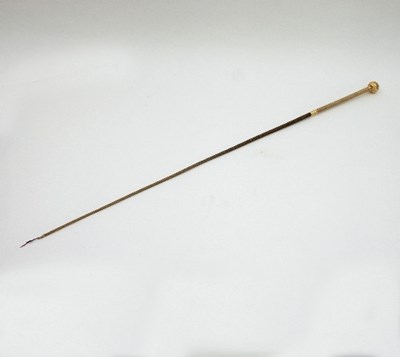 Lot 869 - A yellow metal mounted riding crop, with...