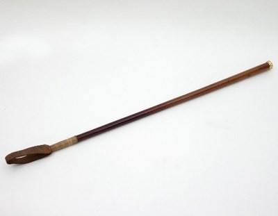 Lot 870 - A yellow metal mounted malacca riding crop,...