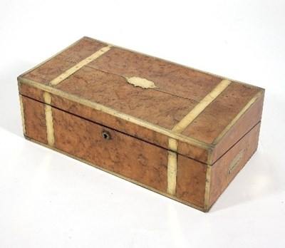 Lot 880 - A Regency birds eye maple and brass bound...