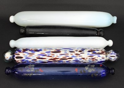 Lot 951 - Five various Nailsea type glass rolling pins,...