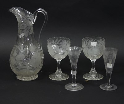 Lot 956 - A glass jug and two glasses, all etched with...