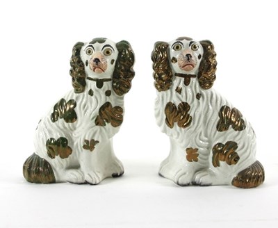 Lot 968 - A pair of Staffordshire pottery spaniels, each...