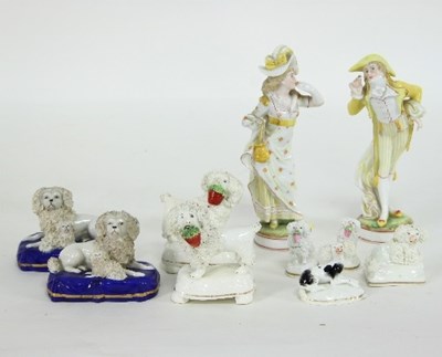 Lot 985 - A pair of French porcelain figures, lady and...