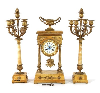 Lot 991 - A late 19th Century clock set, the base and...