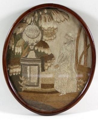 Lot 1029 - A Georgian oval silkwork picture of a young...