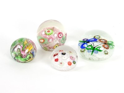 Lot 2 - Two scrambled cane glass paperweights, one...