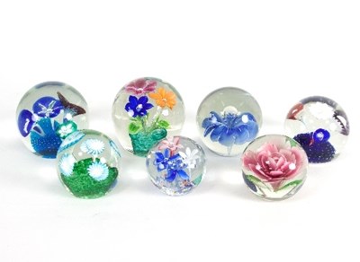 Lot 19 - A group of seven floral glass paperweights...