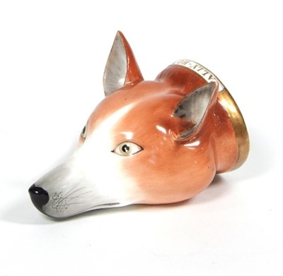 Lot 70 - An English porcelain fox head stirrup cup,...