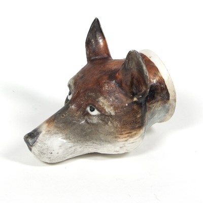 Lot 71 - A Continental porcelain hound head stirrup cup,...