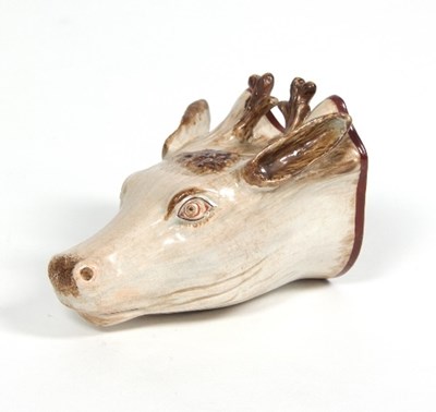 Lot 72 - A Staffordshire pearlware stag head stirrup...