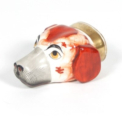 Lot 73 - An English porcelain hound head stirrup cup,...