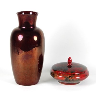 Lot 80 - A red flambe glazed pot and cover by Edward R...
