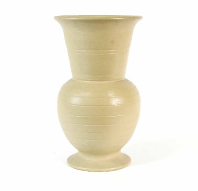 Lot 85 - A tall stylised stoneware vase in the style of...