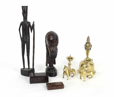 Lot 111 - A pair of Eastern figural brass candlesticks,...