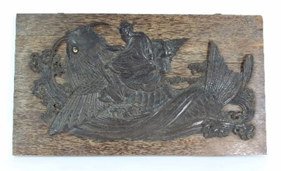 Lot 112 - A hardwood Japanese carving of a man riding a...