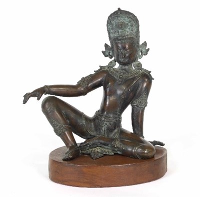 Lot 123 - An Indian bronze figure of a seated deity...