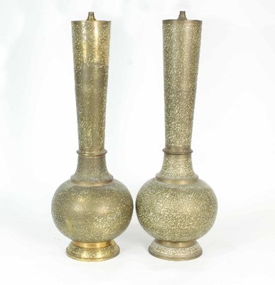 Lot 125 - A pair of Middle Eastern brass and enamel lamp...