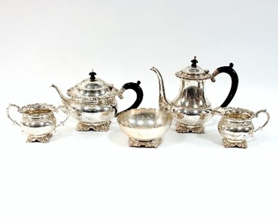 Lot 154 - An Indian white metal four-piece tea and...