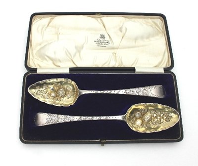 Lot 173 - Two Georgian silver berry spoons, with later...