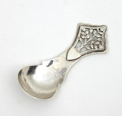 Lot 175 - A silver caddy spoon, JM, London 1973, with...