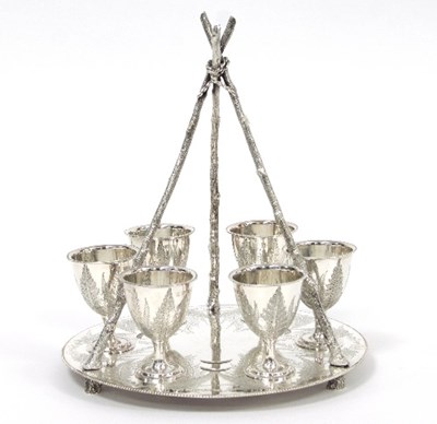 Lot 186 - A Victorian silver egg cup stand and six egg...