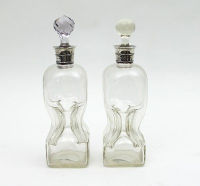 Lot 189 - A pair of Victorian silver mounted decanters,...