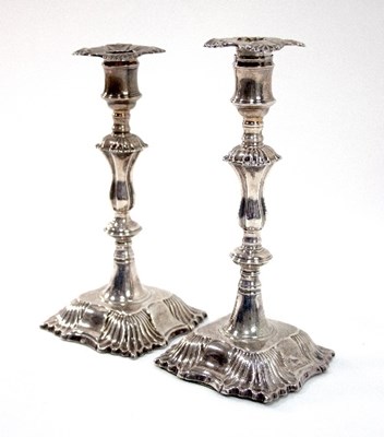 Lot 208 - A pair of George III silver candlesticks,...