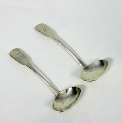 Lot 213 - A near pair of Irish silver sauce ladles,...