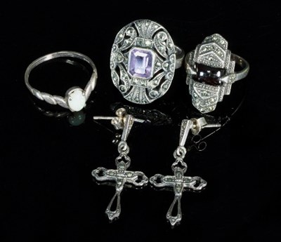 Lot 282 - An amethyst and marcasite set dress ring, the...